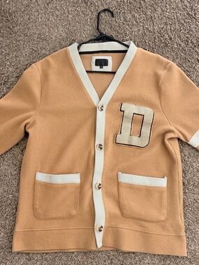 Essentials Tan Cardigan Sweater with Cream Trim and 'D' Patch